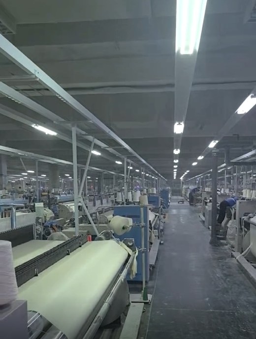 Textile production workshop with weaving machines